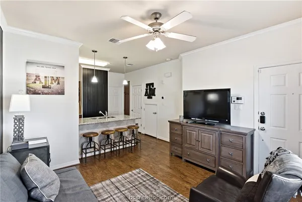 a kitchen with a table and chairs