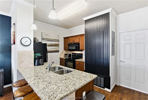 a kitchen with refrigerator and window