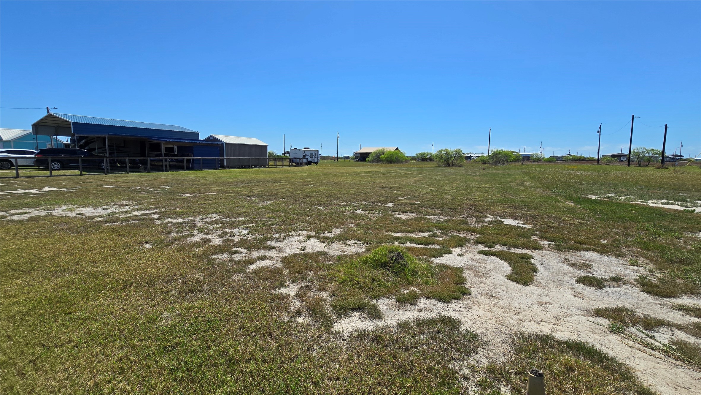 266 Ladyfish Road Palacios, TX 77465 - Photo 3 of 10 a view of a large pool with an outdoor space and seating area