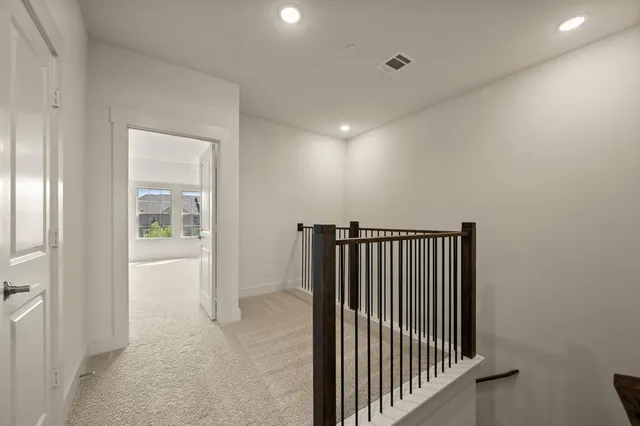 a kitchen with granite countertop white cabinets and stainless steel appliances