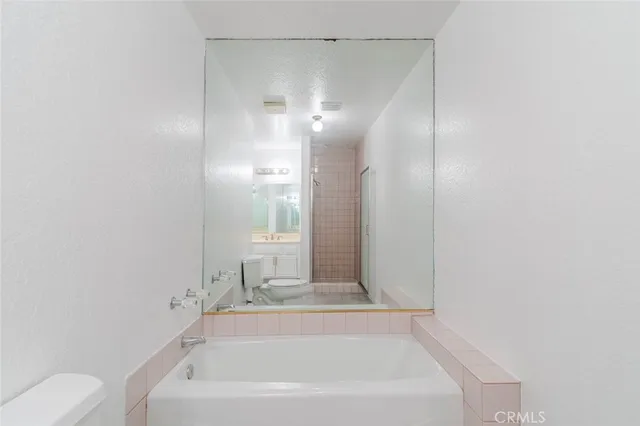a bathroom with a bathtub and a sink