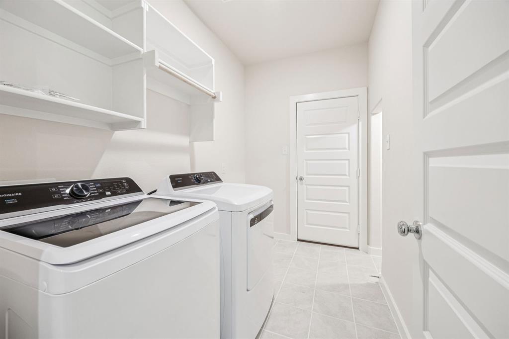 689 Moonlight Place Lavon, TX 75166 - Photo 13 of 29 a view of storage and utility room with washer and dryer