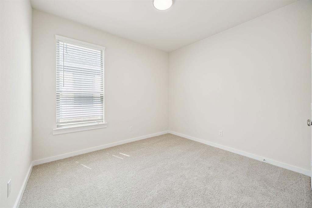 689 Moonlight Place Lavon, TX 75166 - Photo 24 of 29 an empty room with a window