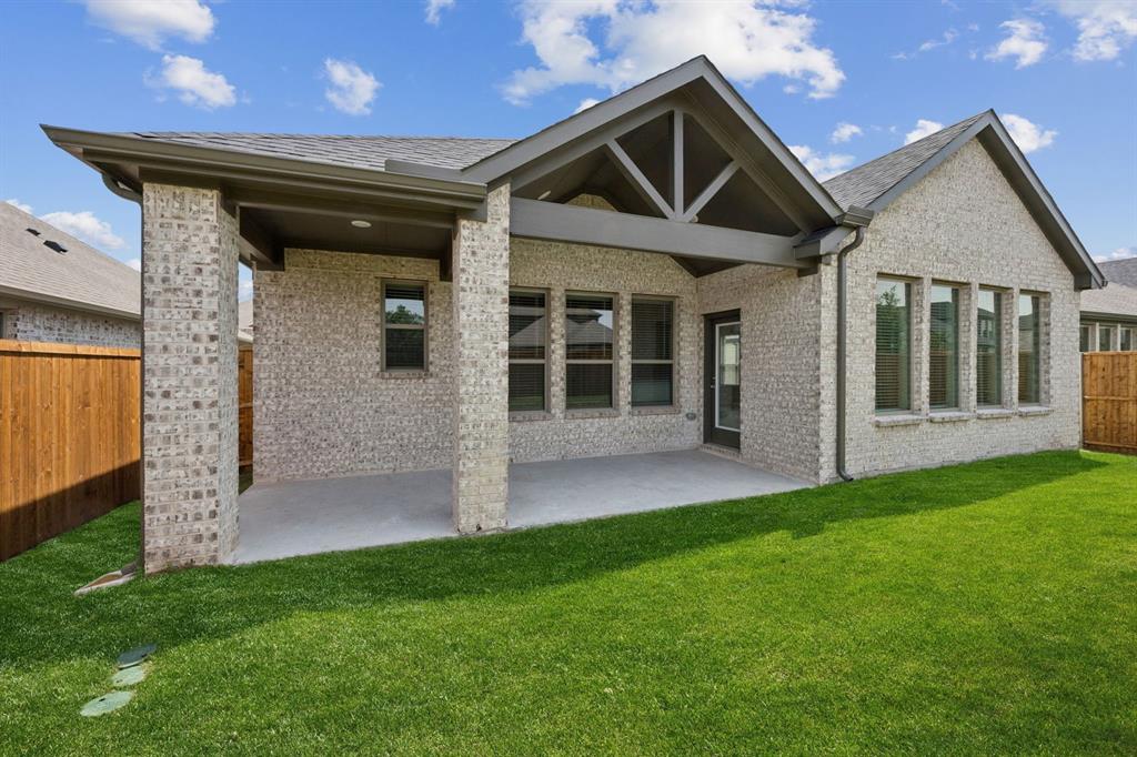 689 Moonlight Place Lavon, TX 75166 - Photo 28 of 29 a front view of a house with a garden