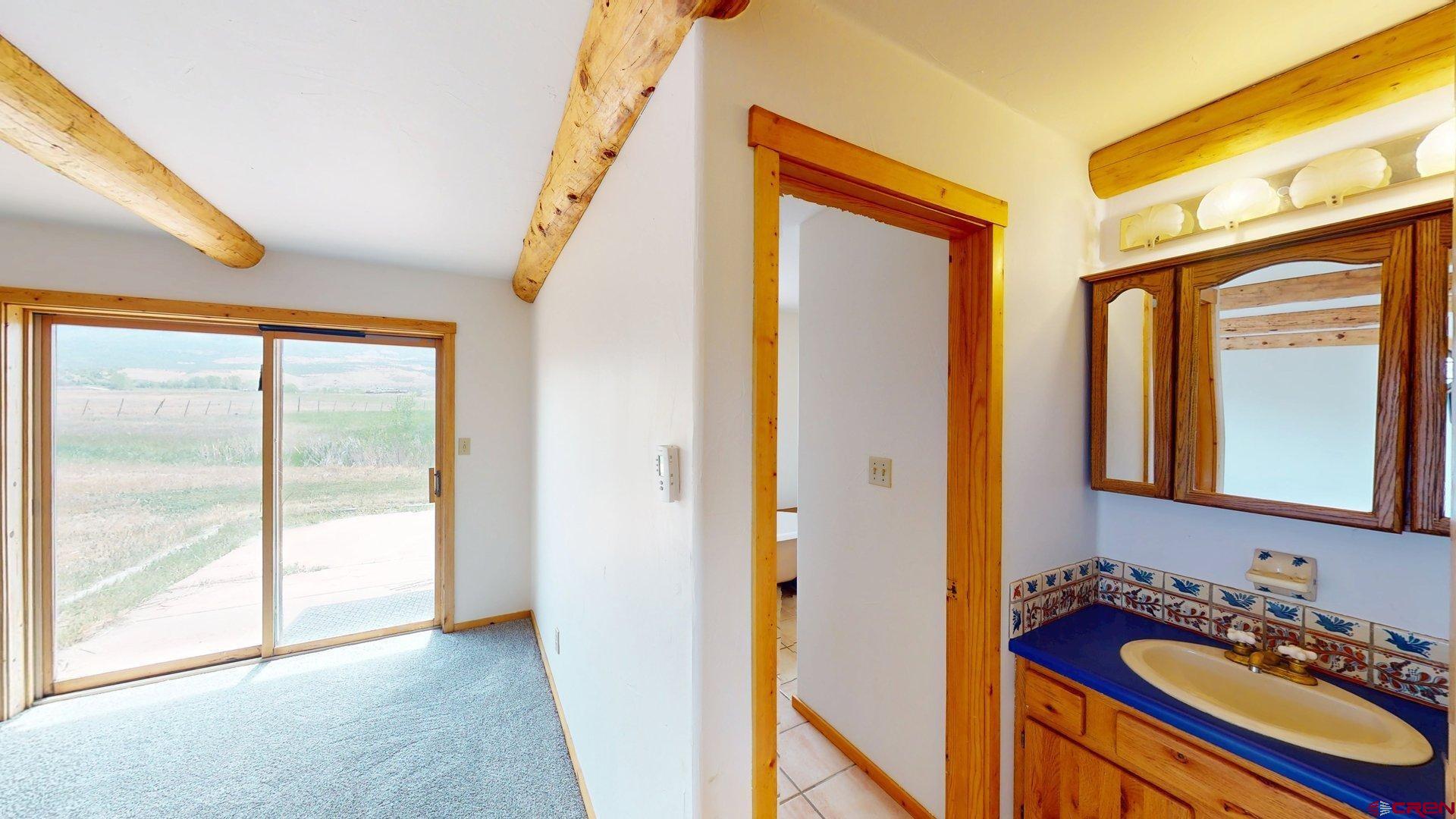 40557 M75 Road Paonia, CO 81428 - Photo 20 of 34 a bathroom with a sink a mirror and a shower
