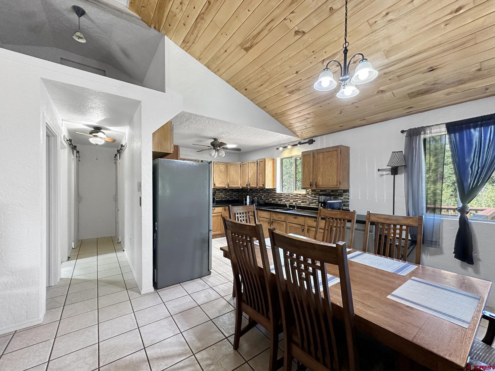 18734 2375th Road Cedaredge, CO 81413 - Photo 12 of 35 a view of a dining room with furniture