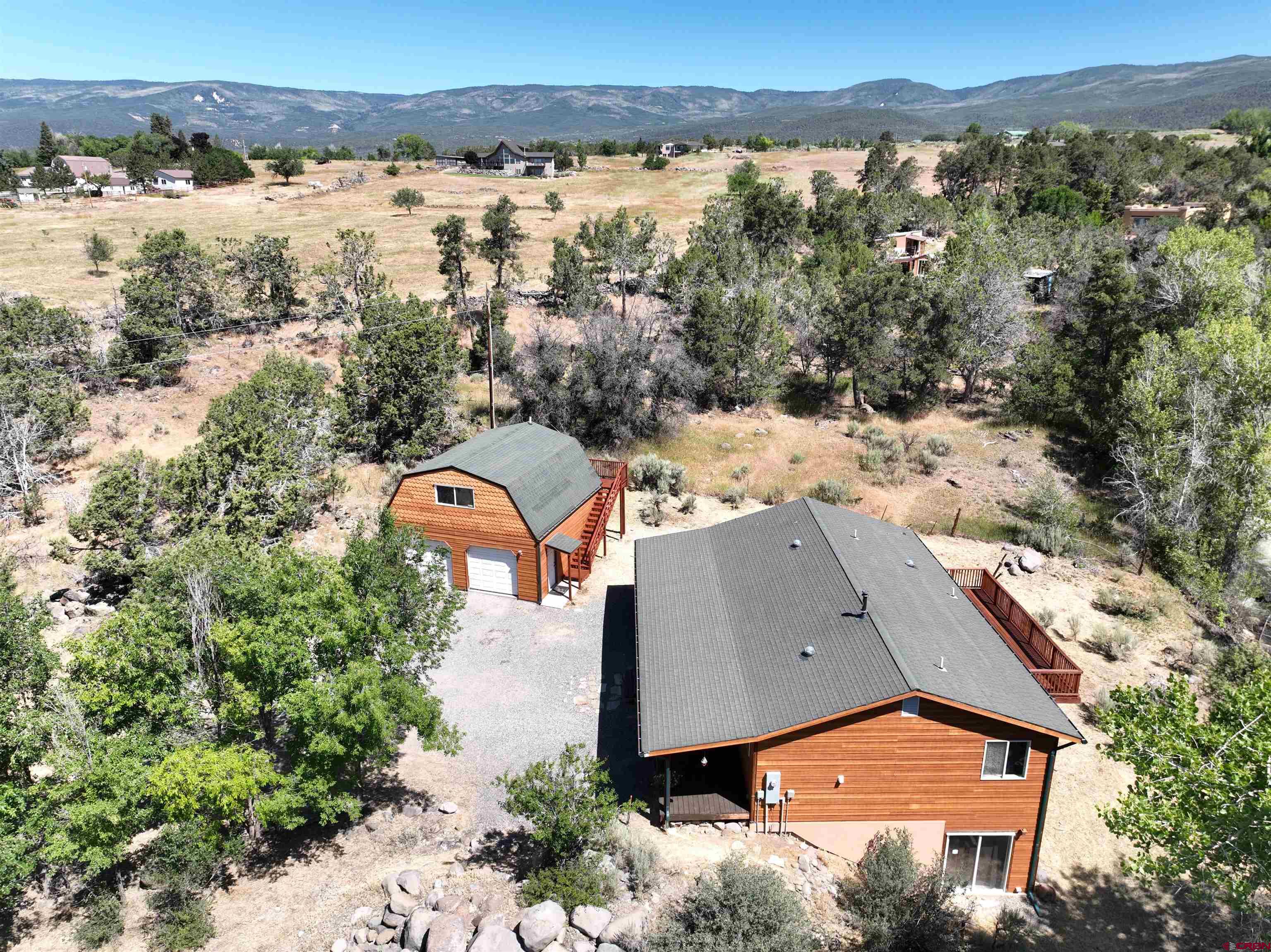 18734 2375th Road Cedaredge, CO 81413 - Photo 32 of 35 an aerial view of a house with a yard and lake view
