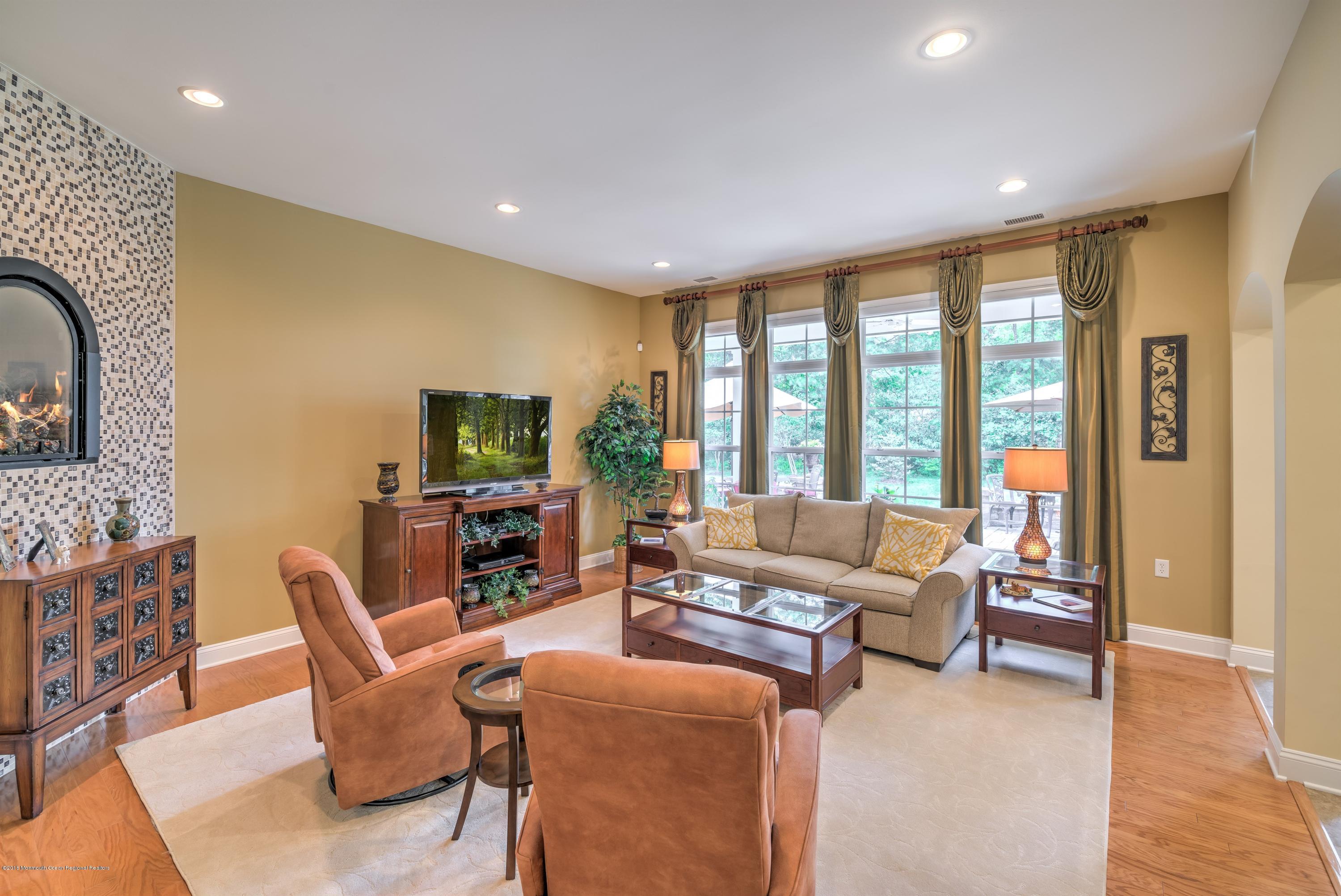 16 East Raphael Lane Farmingdale, NJ 07727 - Photo 11 of 50 a living room with furniture and a large window