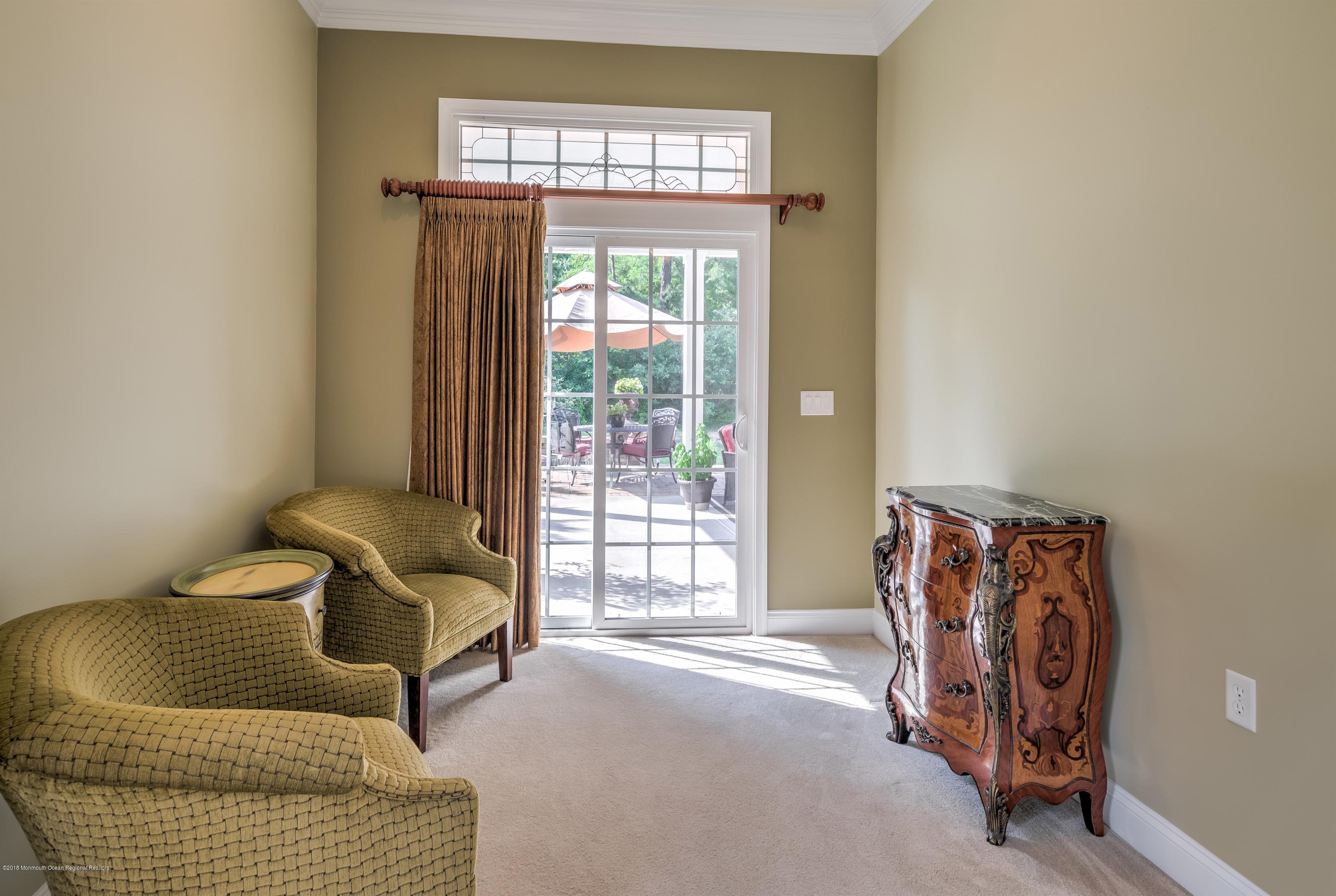 16 East Raphael Lane Farmingdale, NJ 07727 - Photo 18 of 50 a living room with furniture and a window