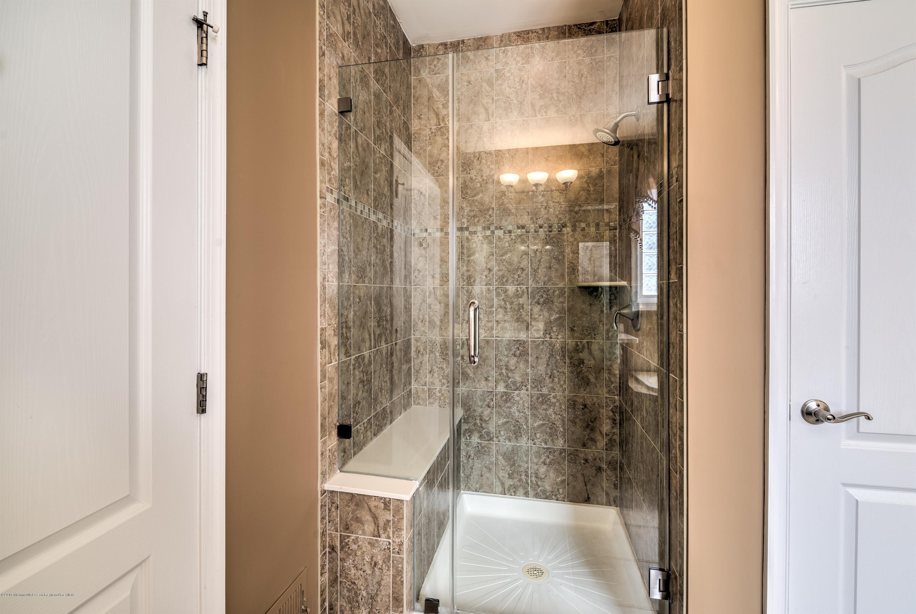 16 East Raphael Lane Farmingdale, NJ 07727 - Photo 21 of 50 a bathroom with a shower and a sink