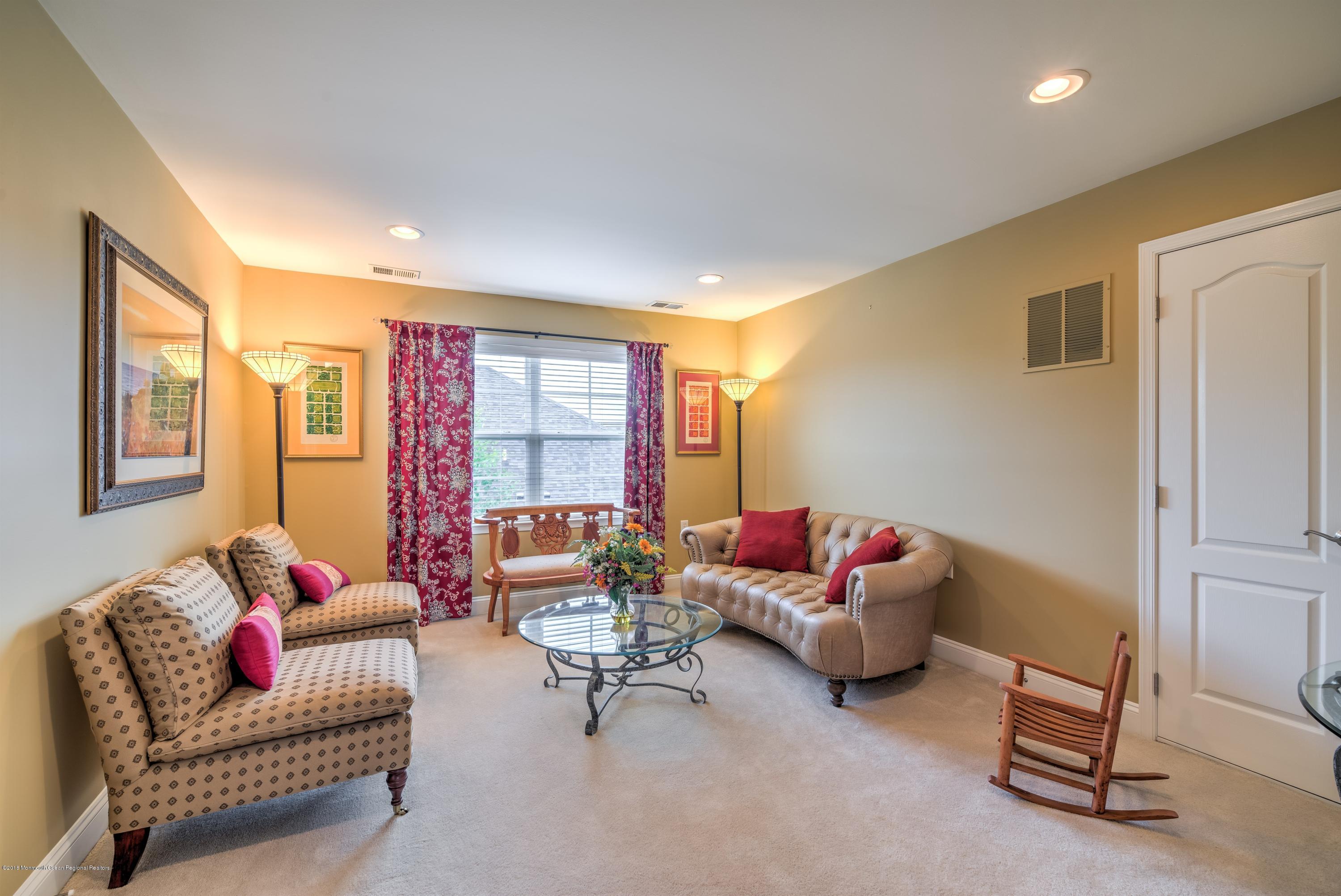 16 East Raphael Lane Farmingdale, NJ 07727 - Photo 22 of 50 a living room with furniture and a large window