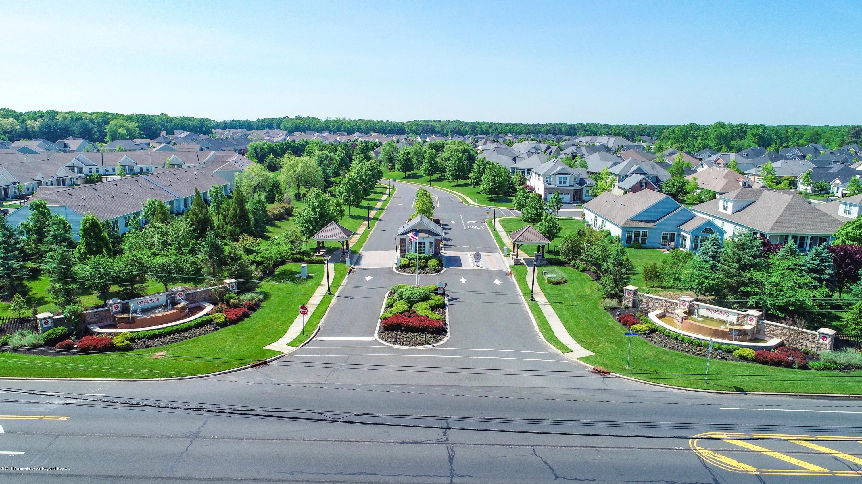 16 East Raphael Lane Farmingdale, NJ 07727 - Photo 33 of 50 an aerial view of a house with a garden and trees