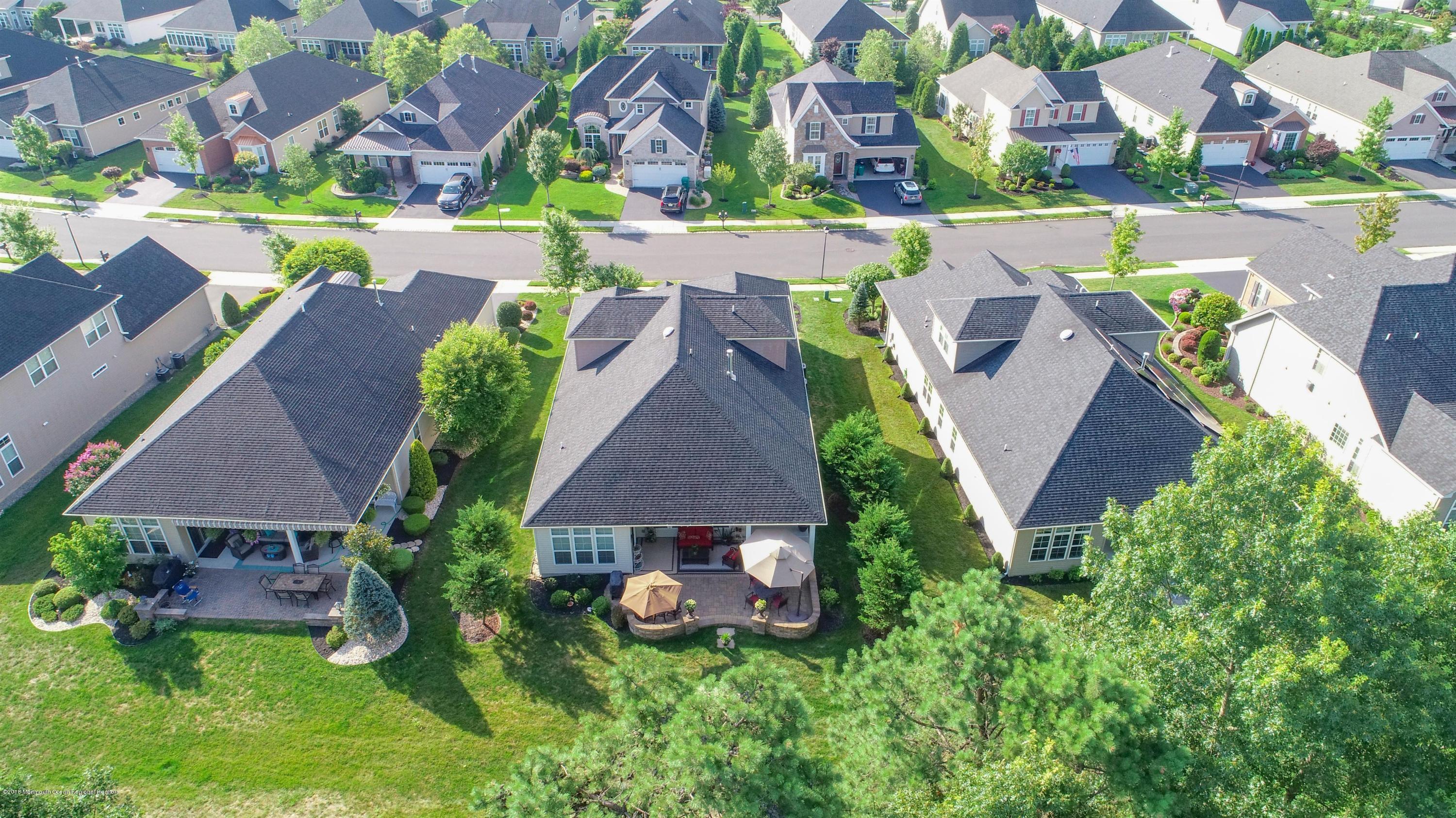 16 East Raphael Lane Farmingdale, NJ 07727 - Photo 41 of 50 an aerial view of a house with garden space and a patio