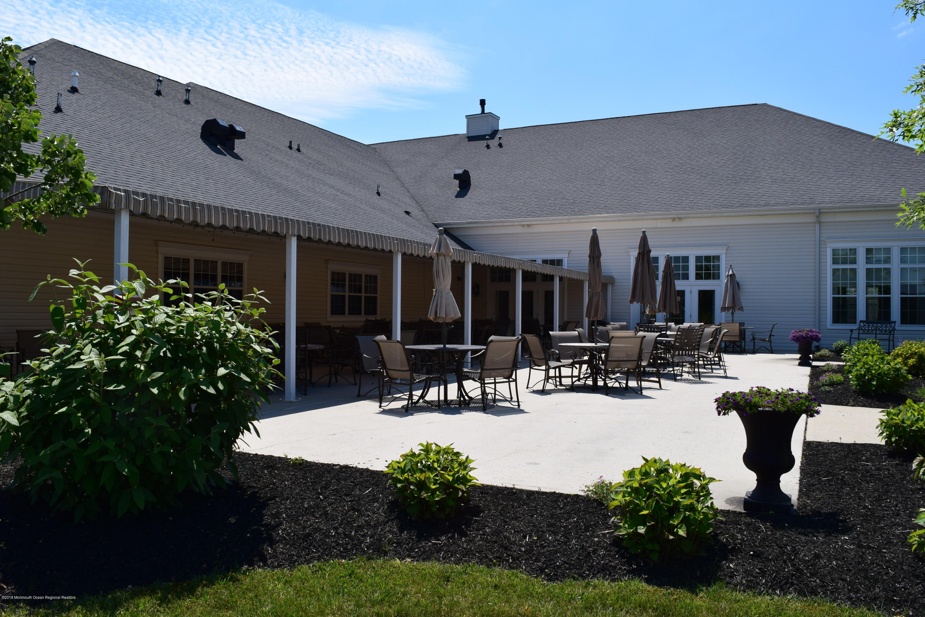 16 East Raphael Lane Farmingdale, NJ 07727 - Photo 44 of 50 a view of a house with backyard and sitting area