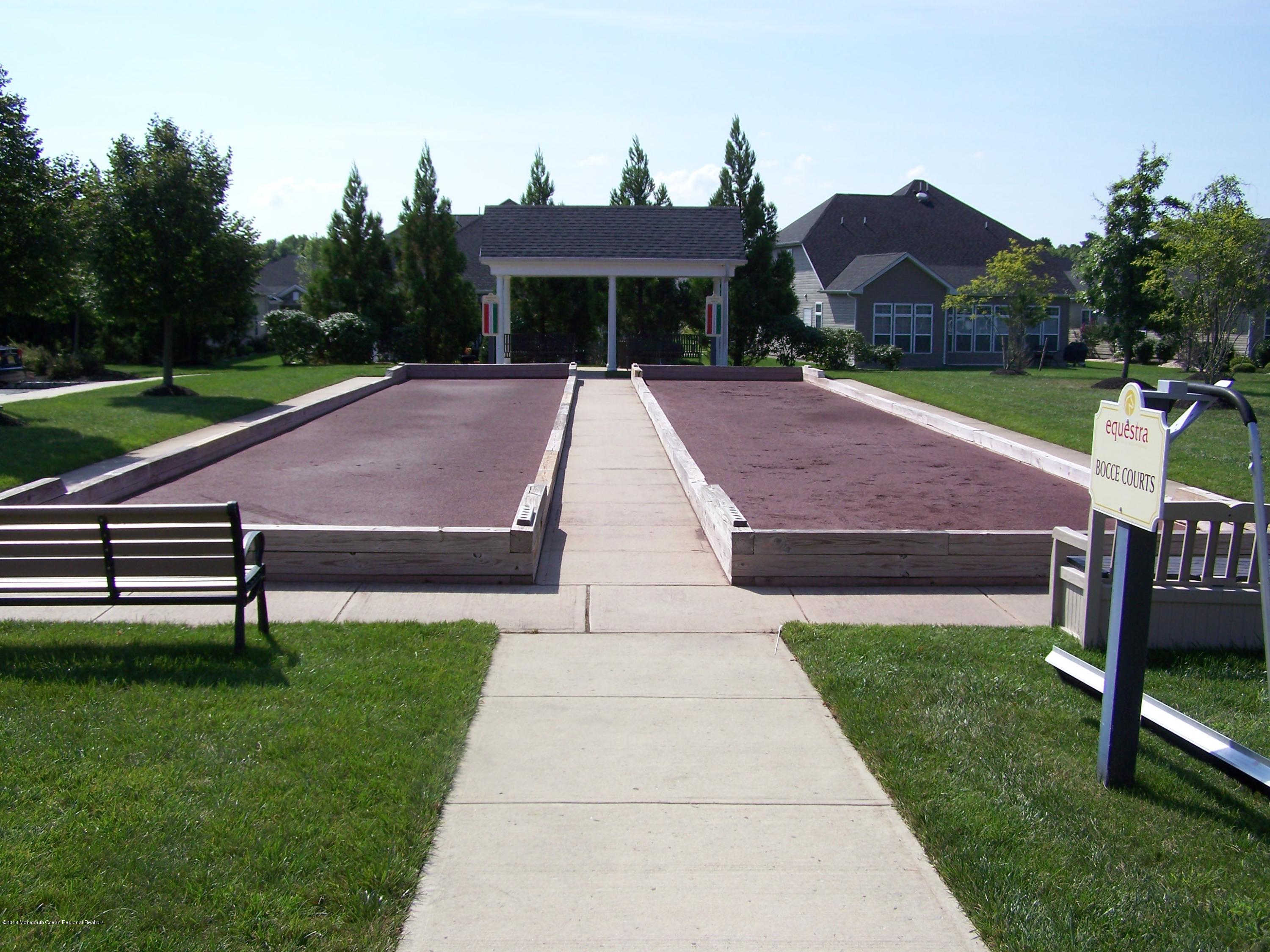 16 East Raphael Lane Farmingdale, NJ 07727 - Photo 45 of 50 a front view of a house with garden