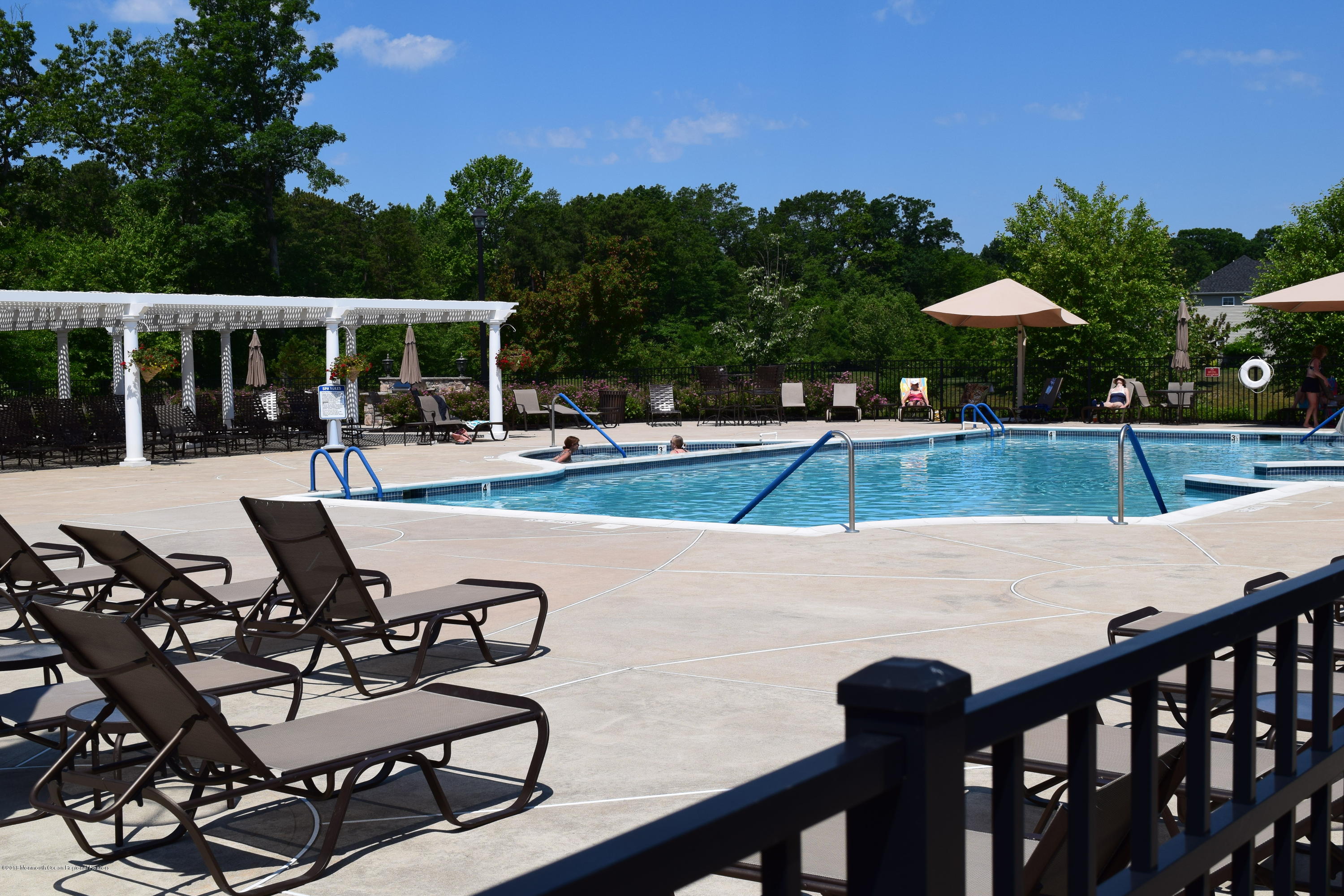 16 East Raphael Lane Farmingdale, NJ 07727 - Photo 47 of 50 a view of a swimming pool with chairs