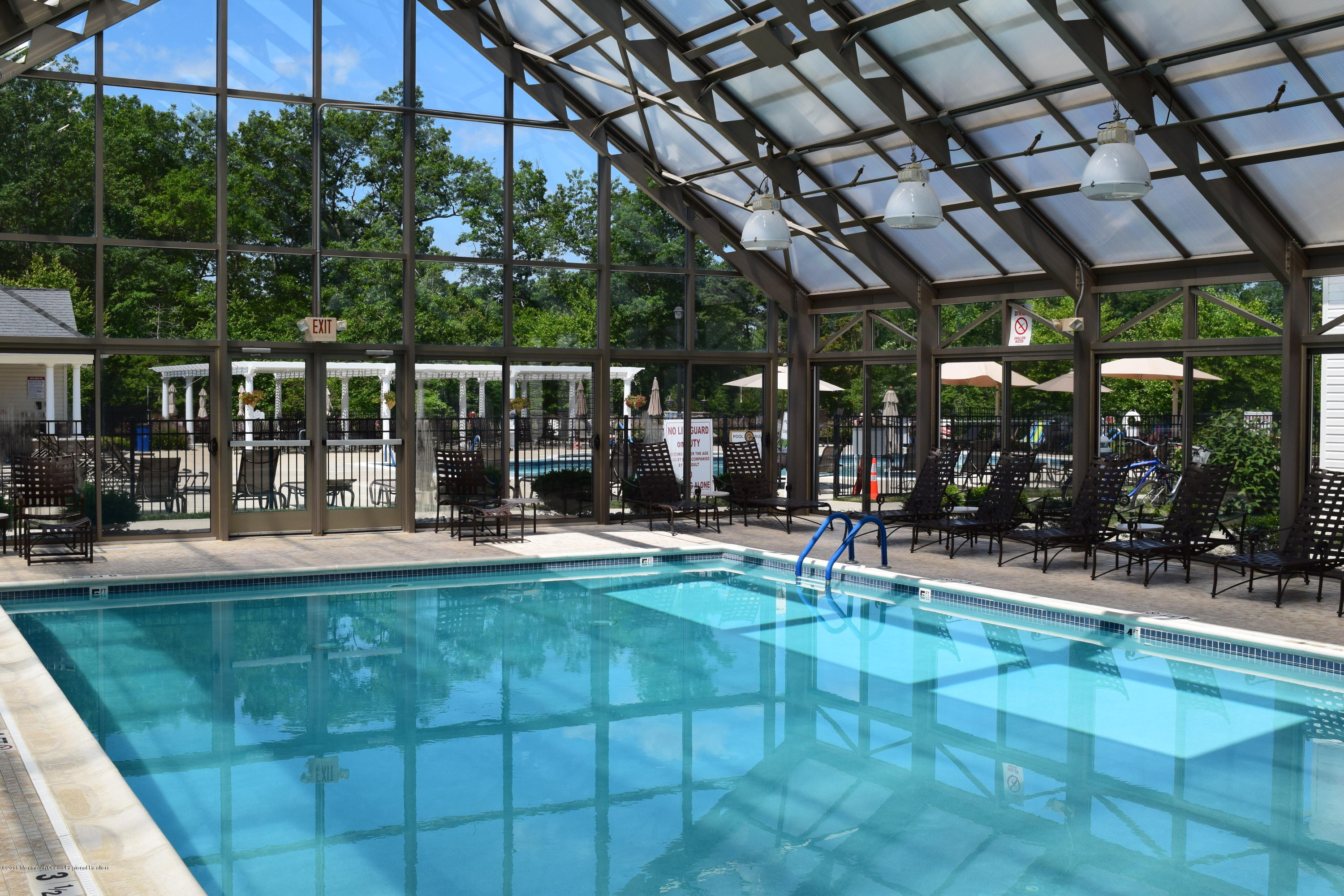 16 East Raphael Lane Farmingdale, NJ 07727 - Photo 48 of 50 a view of a swimming pool with sitting area