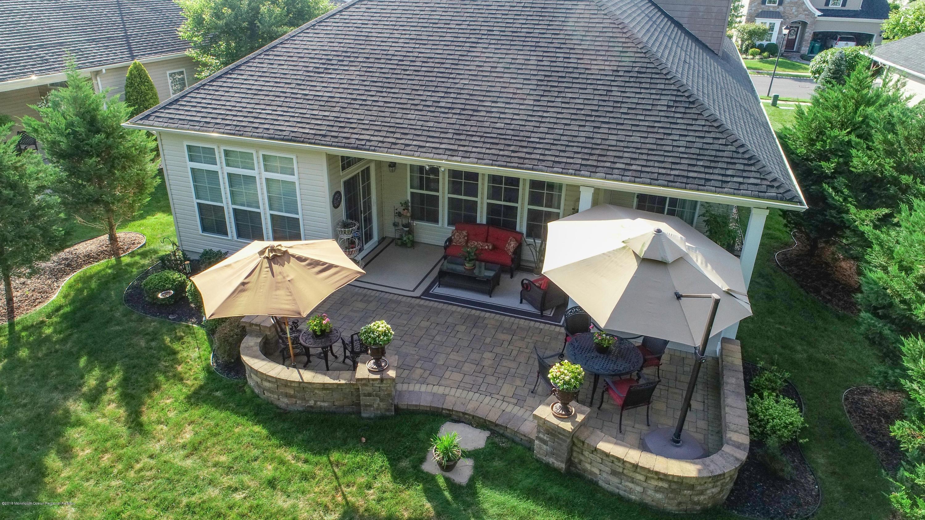16 East Raphael Lane Farmingdale, NJ 07727 - Photo 6 of 50 a house view with a garden space