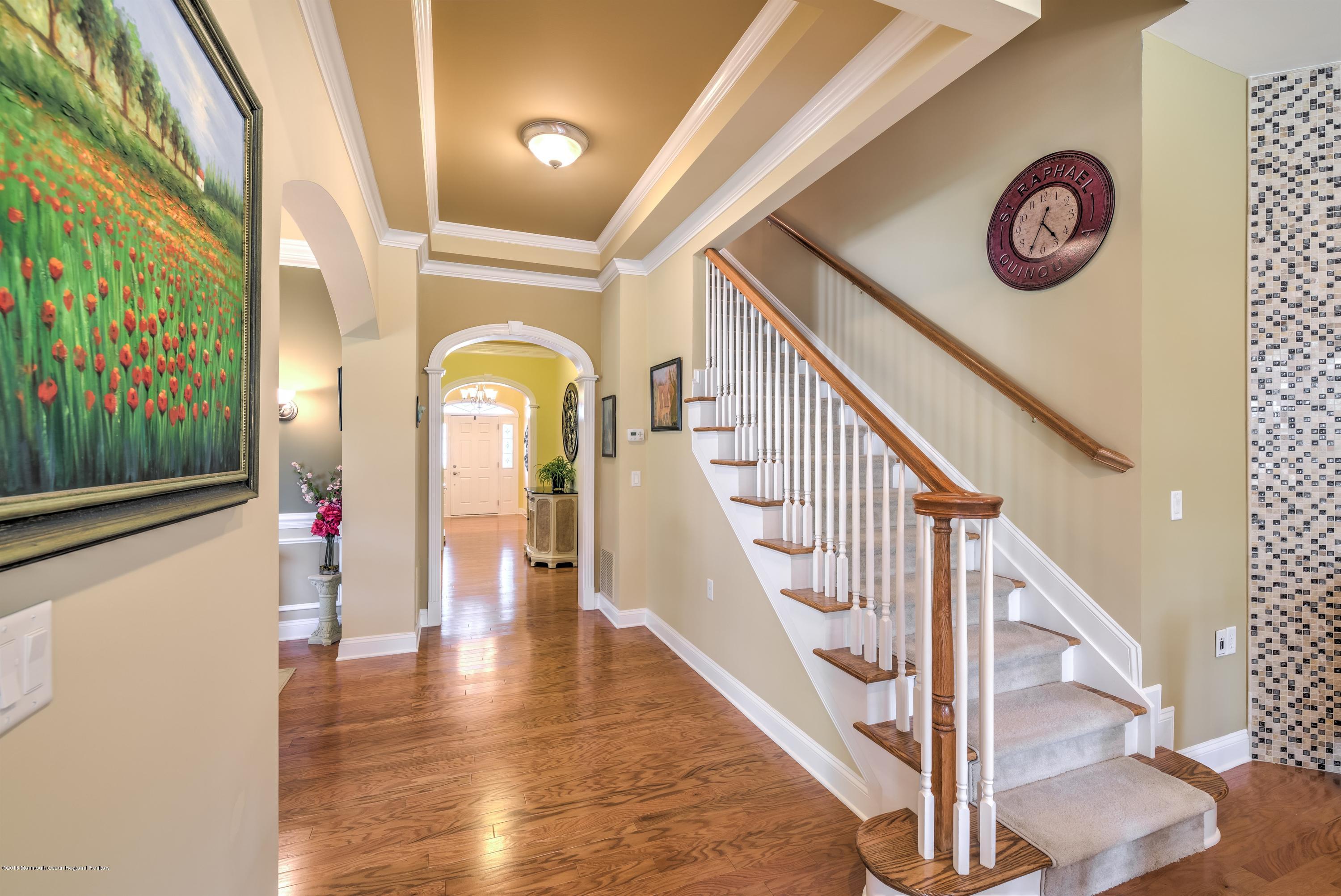 16 East Raphael Lane Farmingdale, NJ 07727 - Photo 8 of 50 a view of entryway with wooden floor