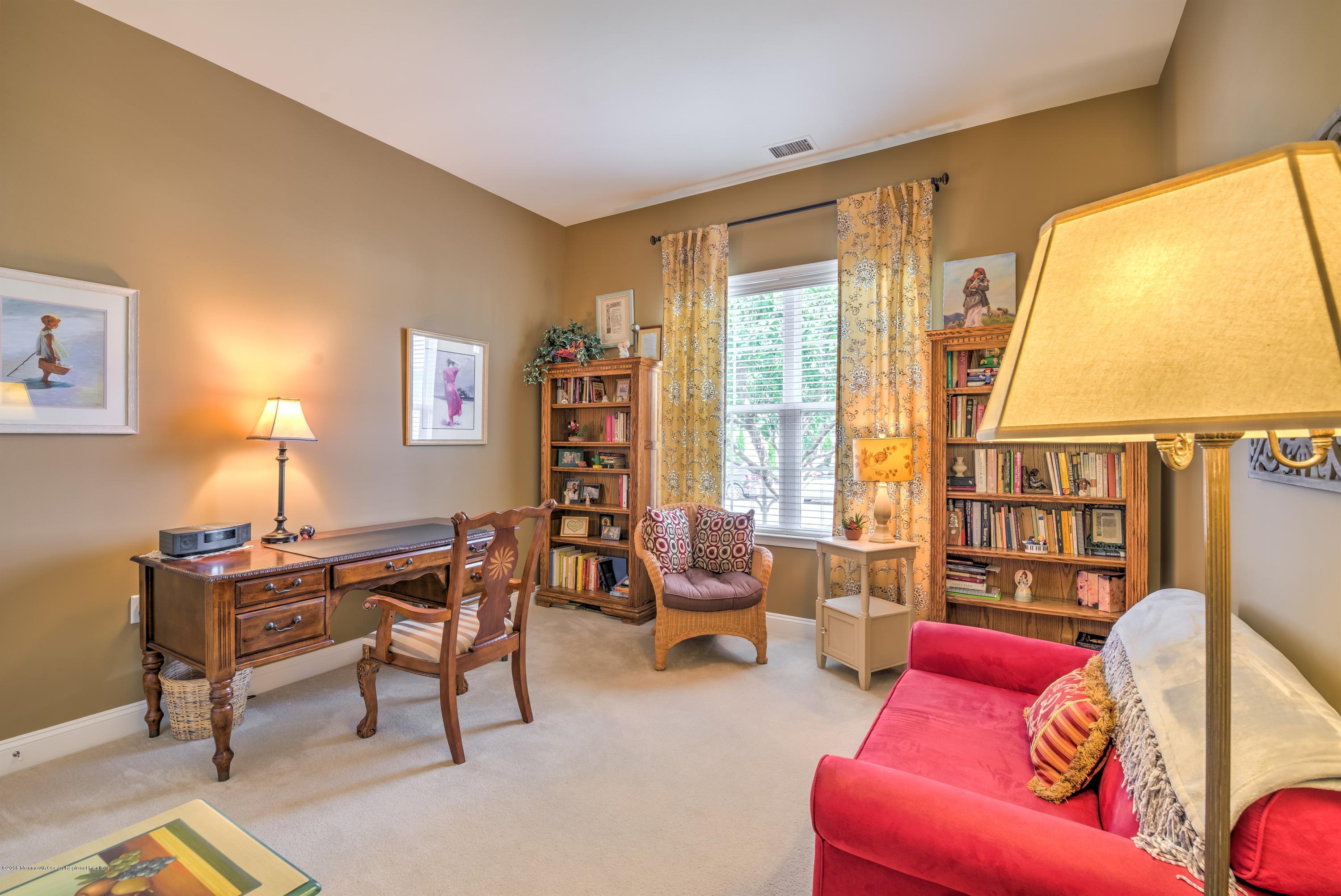 16 East Raphael Lane Farmingdale, NJ 07727 - Photo 9 of 50 a living room with furniture and a large window