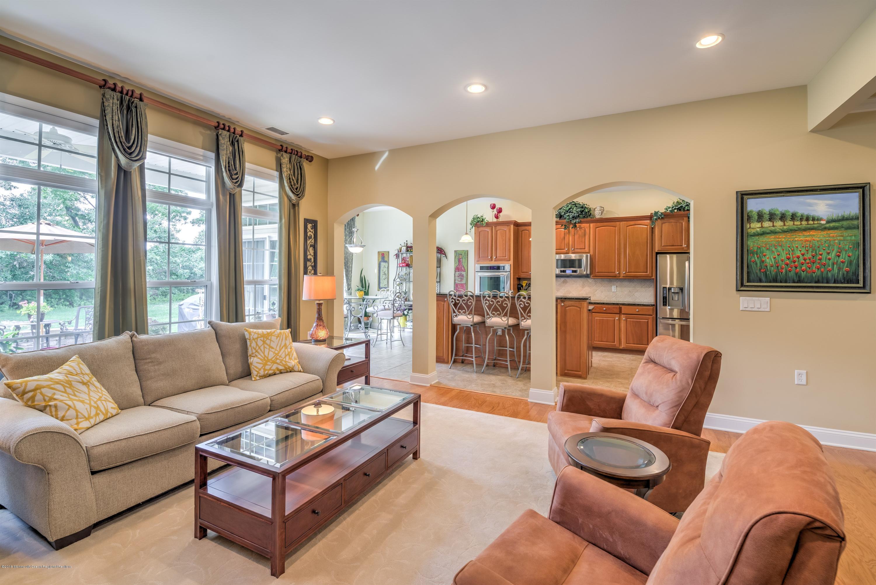 16 East Raphael Lane Farmingdale, NJ 07727 - Photo 10 of 50 a living room with furniture and a large window