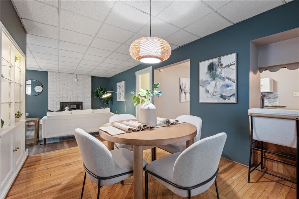 309 Highland Terrace Pittsburgh, PA 15215 - Photo 14 of 47 Gleaming hardwood floors highlight the dining room area. A pass through/breakfast bar area provides a convenient connection to the kitchen, and extra seating.