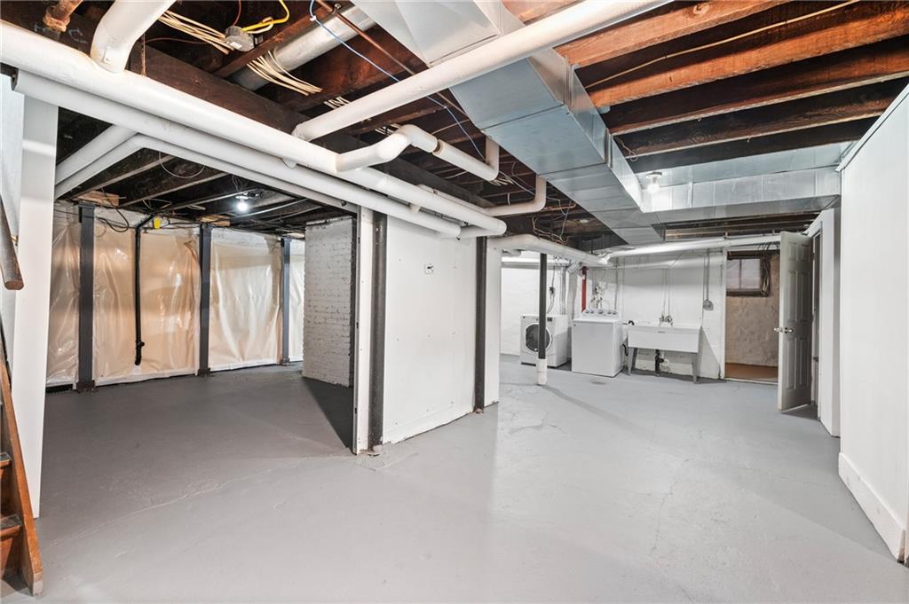 309 Highland Terrace Pittsburgh, PA 15215 - Photo 27 of 47 Large, clean basement with high ceilings and lots of storage.