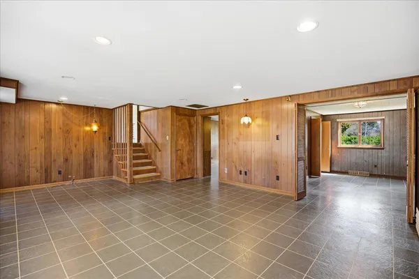 a view of an empty room with windows