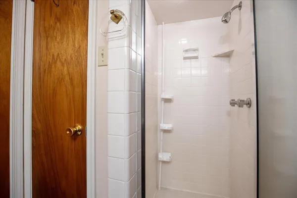 a view of a room with wooden shelves