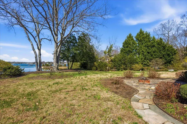 an aerial view of a house with a lake view