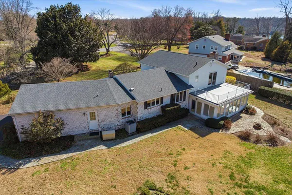 a view of an empty room with glass door and balcony