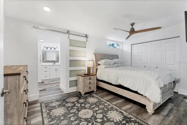 a bedroom with a bed and a view of bathroom