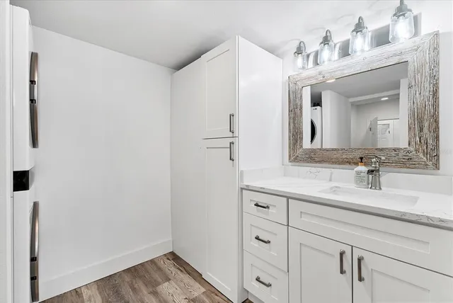 a en suite bathroom with a sink and a mirror