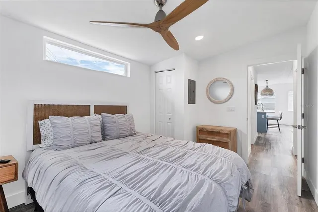 a bedroom with a bed and window