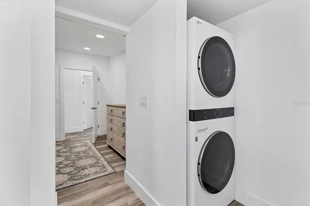 a view of a storage and utility room with washer and dryer