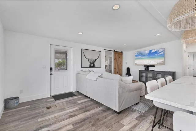 a living room with furniture and a table