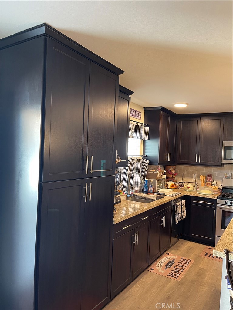 110 Main Street Piru, CA 93040 - Photo 4 of 15 a kitchen with a sink and cabinets
