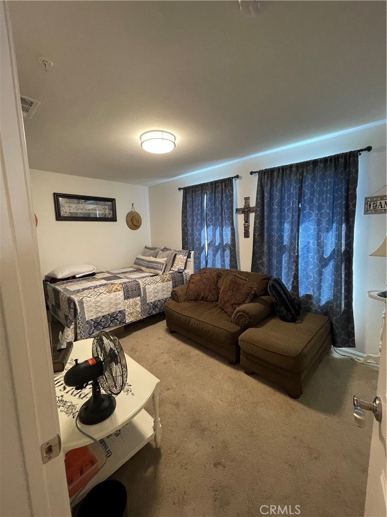 110 Main Street Piru, CA 93040 - Photo 8 of 15 a living room with furniture and a wooden floor