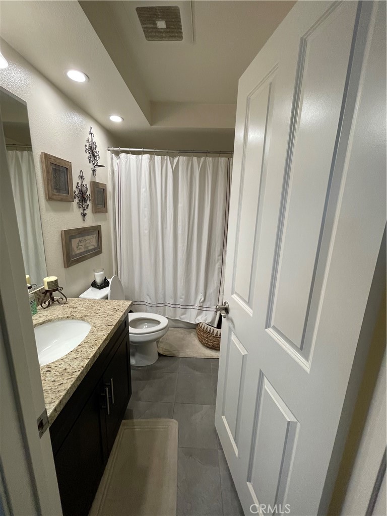 110 Main Street Piru, CA 93040 - Photo 9 of 15 a bathroom with a double vanity sink and a mirror