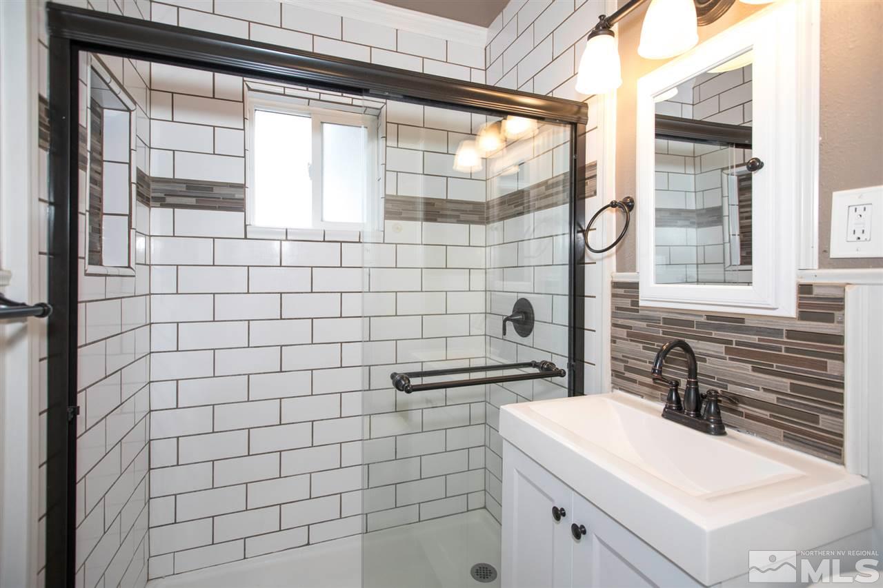 725 Balzar Circle Reno, NV 89502 - Photo 15 of 22 a bathroom with a sink a toilet and shower