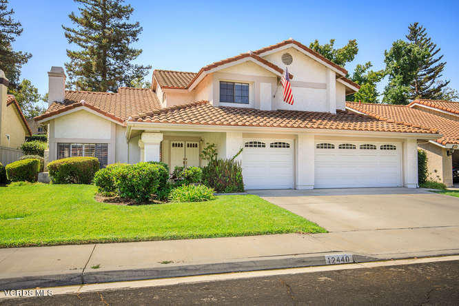12440 Crystal Ranch Road Moorpark, CA 93021 - Photo 2 of 51 a front view of a house with a yard and garage