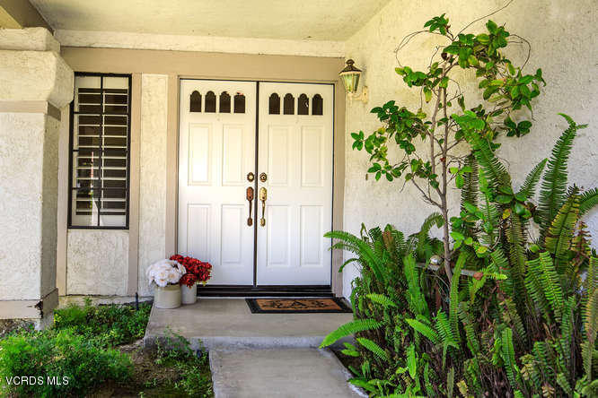 12440 Crystal Ranch Road Moorpark, CA 93021 - Photo 3 of 51 a front view of a house with a garden