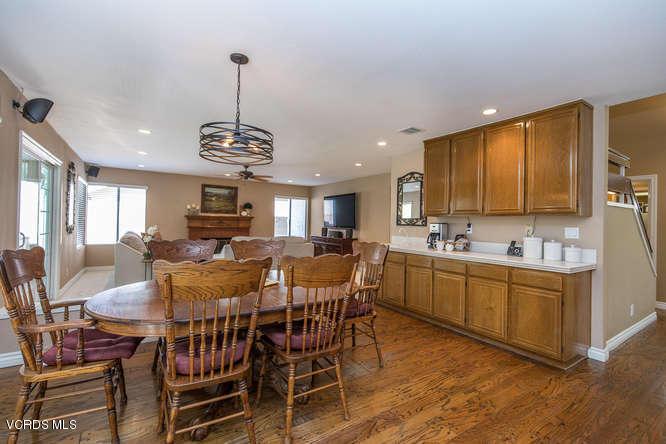 12440 Crystal Ranch Road Moorpark, CA 93021 - Photo 22 of 51 a view of a dining room with furniture window and wooden floor