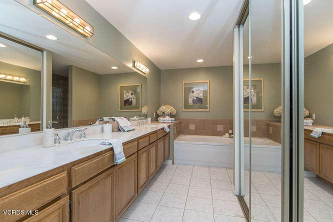 12440 Crystal Ranch Road Moorpark, CA 93021 - Photo 36 of 51 a bathroom with a tub sink shower and mirror