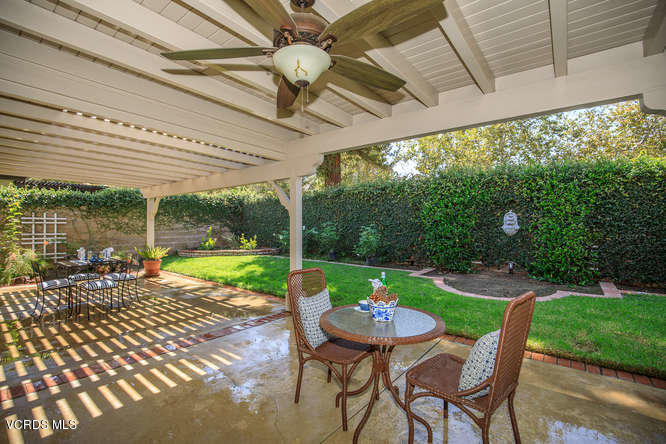 12440 Crystal Ranch Road Moorpark, CA 93021 - Photo 43 of 51 a view of a patio with a table chairs and a backyard