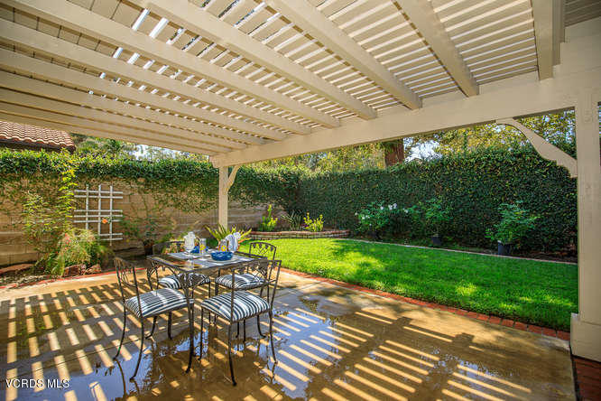 12440 Crystal Ranch Road Moorpark, CA 93021 - Photo 45 of 51 a view of a patio with table and chairs potted plants with wooden floor