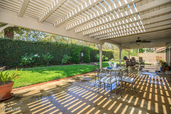 12440 Crystal Ranch Road Moorpark, CA 93021 - Photo 46 of 51 a view of a patio with a table chairs and a backyard