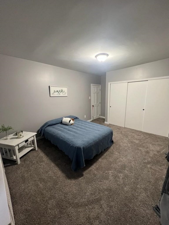 77 Carter Street Fall River, MA 02721 - Photo 11 of 25 a bedroom with a bed and a table in it