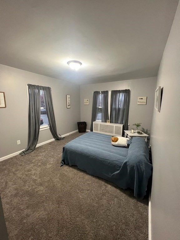 77 Carter Street Fall River, MA 02721 - Photo 13 of 25 a bedroom with a bed and a dresser