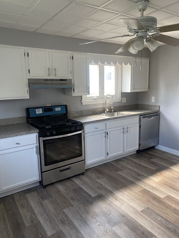 77 Carter Street Fall River, MA 02721 - Photo 15 of 25 a kitchen with stainless steel appliances granite countertop a stove a sink and white cabinets